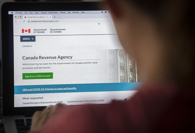 A person looks at a Canada Revenue Agency homepage in Montreal on Aug. 16,