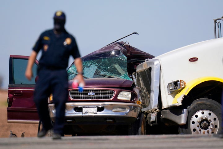 Law enforcement officers work at the scene of a deadly crash in Holtville, California, on Tuesday. 
