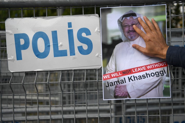 A protester holds a picture of Khashoggi, whose body has never been found, during a demonstration in front of the Saudi Arabi