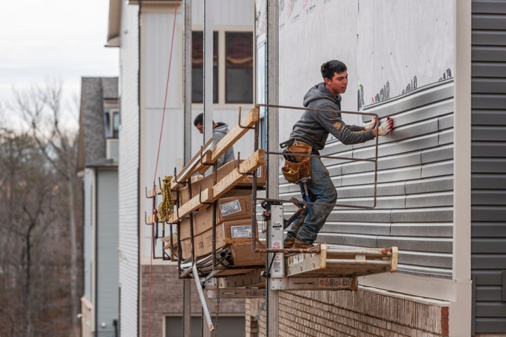 Construction workers in Laurel, Maryland, on Feb. 6, 2020. Buildings use roughly 40% of all energy produced in the U.S. for heating, power and cooking appliances, and generate a proportional share of the country’s planet-heating gases.