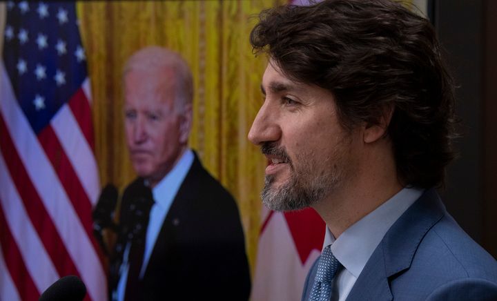 United States President Joe Biden listens as Canadian Prime Minister Justin Trudeau delivers his statement during a virtual joint statement following a virtual meeting in Ottawa on Feb. 23, 2021.
