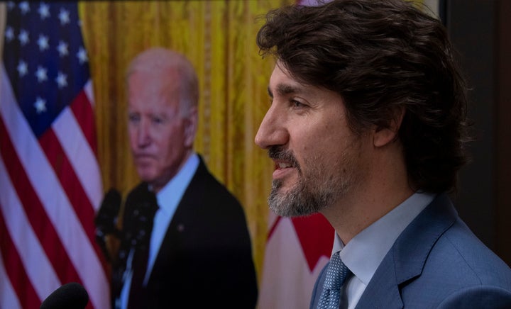 United States President Joe Biden listens as Canadian Prime Minister Justin Trudeau delivers his statement during a virtual joint statement following a virtual meeting in Ottawa on Feb. 23, 2021.