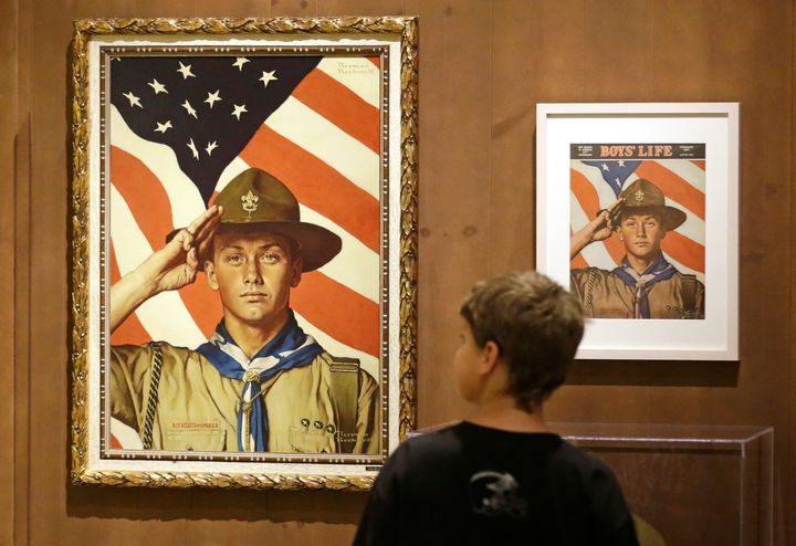 In this July 22, 2013, file photo, a youth looks over the Rockwell exhibition in Salt Lake City.