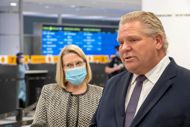 Ontario Premier Doug Ford and Solicitor General Sylvia Jones answer questions after touring the COVID-19 testing centre at Pearson Airport in Toronto on Feb. 3, 2021.