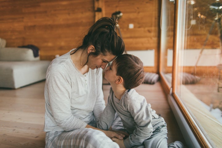 A young mother bonds with her son during a winter holiday.