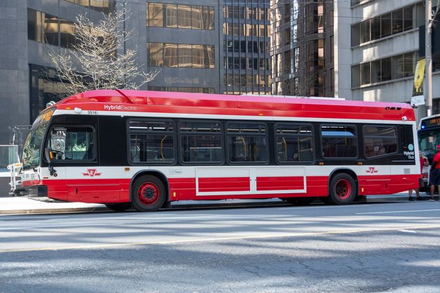 A TTC hybrid electric bus is seen waiting on University Avenue in Toronto on May 24,
