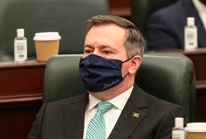 Alberta Premier Jason Kenney listens as the 2021 budget is delivered in Edmonton Alta, on Feb. 25, 2021.