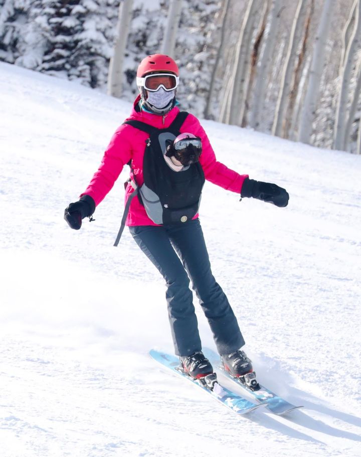 The author skiing with her service animal, Maeve, in a front-pack at Deer Valley Resort in Park City, Utah, on Jan. 25.
