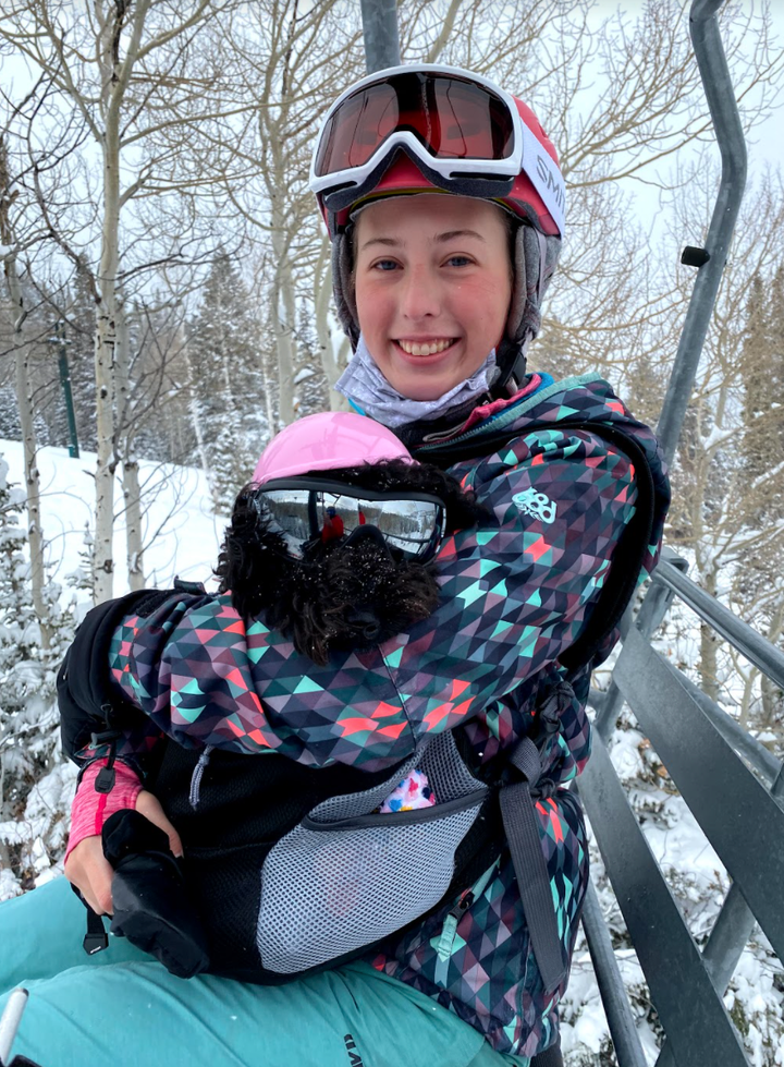 The author riding a chairlift with her service animal at the Deer Valley Resort on Jan. 23.