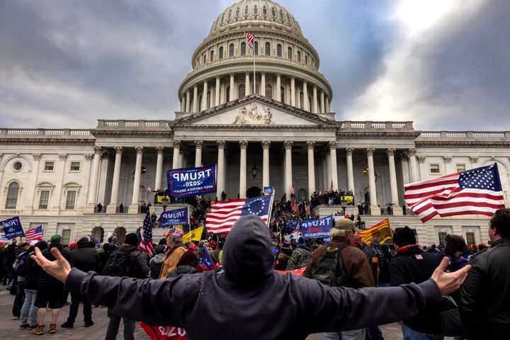 A mob of unambiguous Trump supporters stands outside the Capitol on Jan. 6.