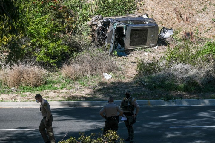 A vehicle rests on its side after a rollover accident involving golfer Tiger Woods on Feb. 23 along a road in the Rancho Palos Verdes suburb of Los Angeles.