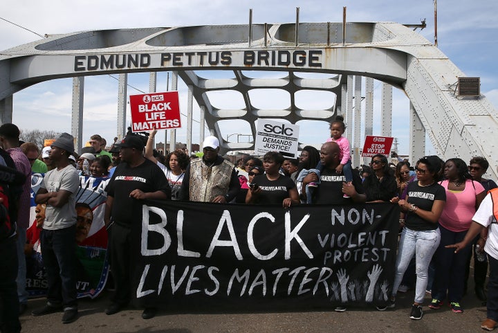 Thousands of people walk across the Edmund Pettus Bridge during the 50th anniversary on March 8, 2015 in Selma, Alabama.  Thi