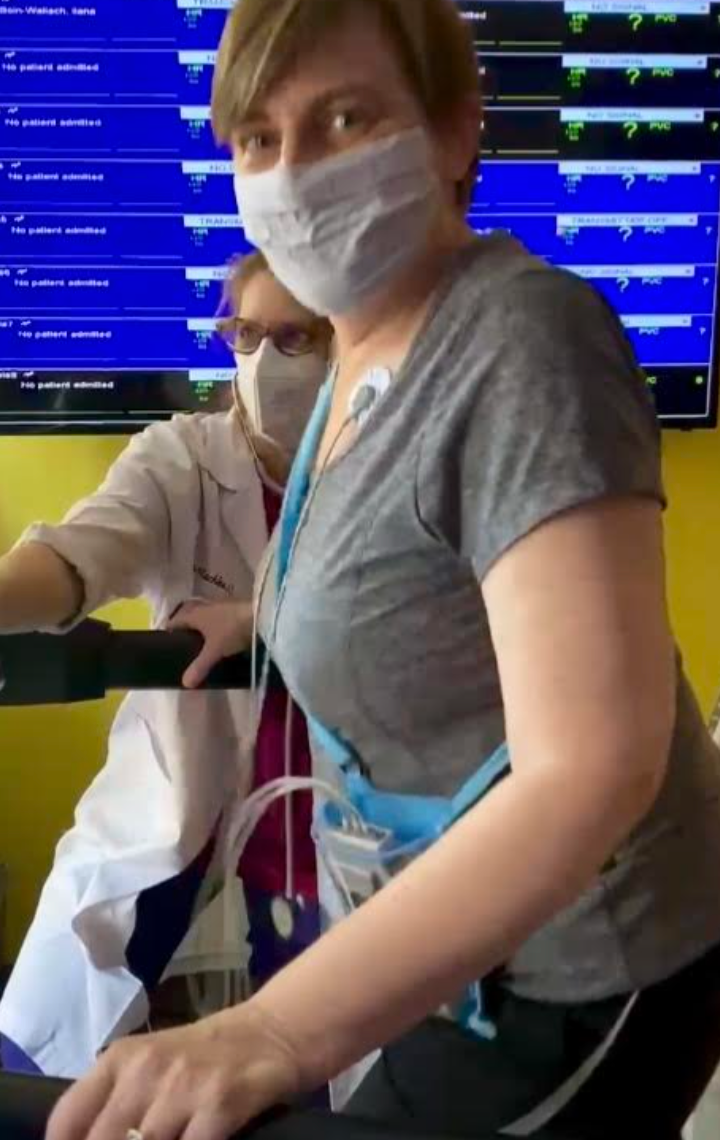 The author on the treadmill for post-COVID rehab with Marion Mackles at H&amp;D Physical Therapy's pulmonary wellness clinic 