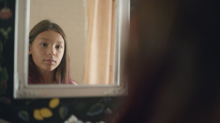 Nine year-old Sawyer brushing and styling her hair in her family bathroom.(Photograph: Courtesy of Pantene)