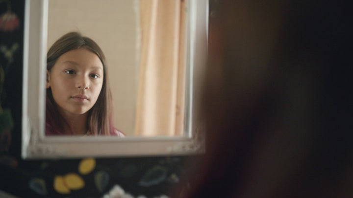 <strong>Nine year-old Sawyer brushing and styling her hair in her family bathroom.</strong><br>(Photograph: Courtesy of Pantene)