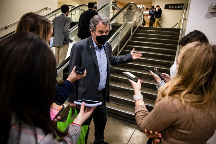 Sen. Sherrod Brown (D-Ohio) talks to reporters in February. He is one of the senators who introduced the American Family Act in 2018, which served as a model for portions of the COVID-19 relief bill set to pass in Congress this week. 