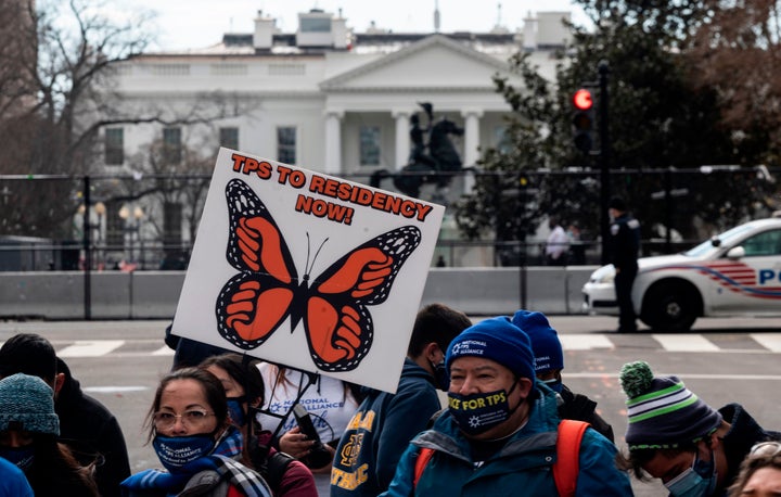 Activists and citizens with temporary protected status (TPS) march along 16th Street toward the White House in a call for Congress and the Biden administration to pass immigration reform legislation on February 23, 2021 in Washington, DC. 