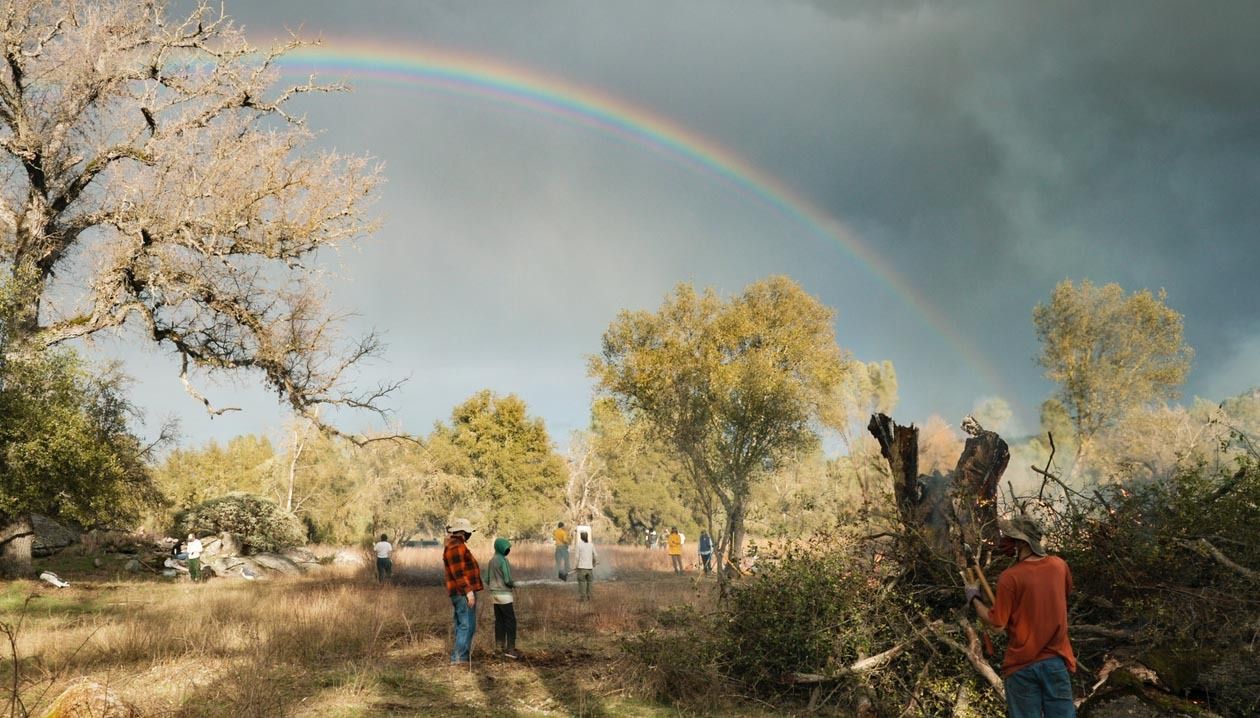 Once the rain stops, a rainbow forms over the property in Mariposa, California, as volunteers finish up the first day of work.
