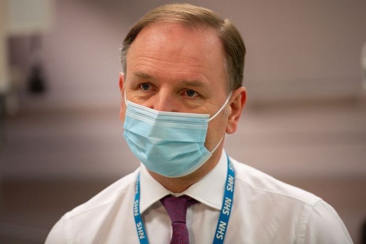 Sir Simon Stevens gestures during a visit to a Covid-19 vaccination clinic at University Hospital Coventry in the Walsgrave on Sowe area of Coventry, West Midlands on February 12