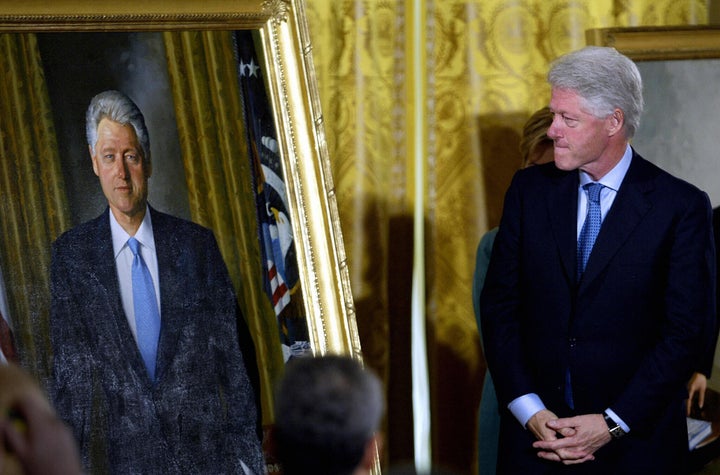 Former President Bill Clinton views his official White House portrait before it was hung in the grand foyer during the unveil