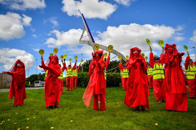 The Red Rebels from Extinction Rebellion protest against the airport's expansion in August, 2020.