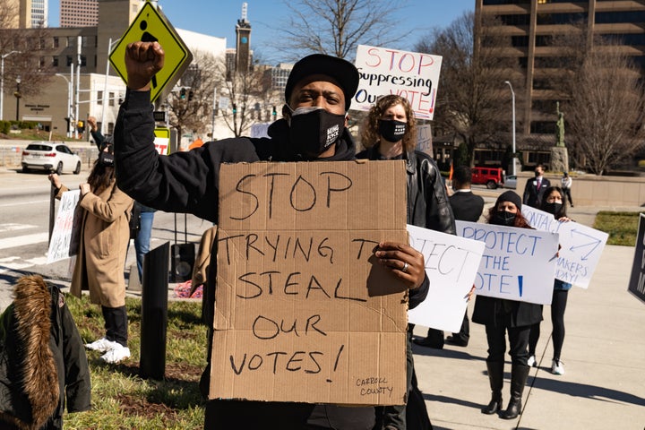 Demonstrators oppose Georgia's H.B. 531, which would restrict ballot drop boxes, require IDs for absentee voting and limit we