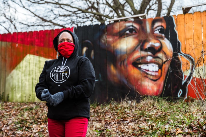 Rep. Attica Scott (D-KY) address a group of protesters and a group called the "Say Her Name Bike Ride" in front of a mural of