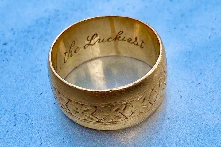 The author's wedding band, on which her husband engraved the line "I am the luckiest," from their wedding song.