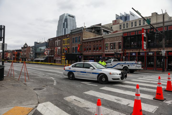 NASHVILLE, TN - DECEMBER 25: A police car blocks the street after an explosion on December 25, 2020 in Nashville, Tennessee. According to initial reports, a vehicle exploded downtown in the early morning hours. (Photo by Thaddaeus McAdams/Getty Images)
