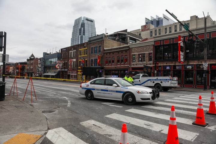 NASHVILLE, TN - DECEMBER 25: A police car blocks the street after an explosion on December 25, 2020 in Nashville, Tennessee. 