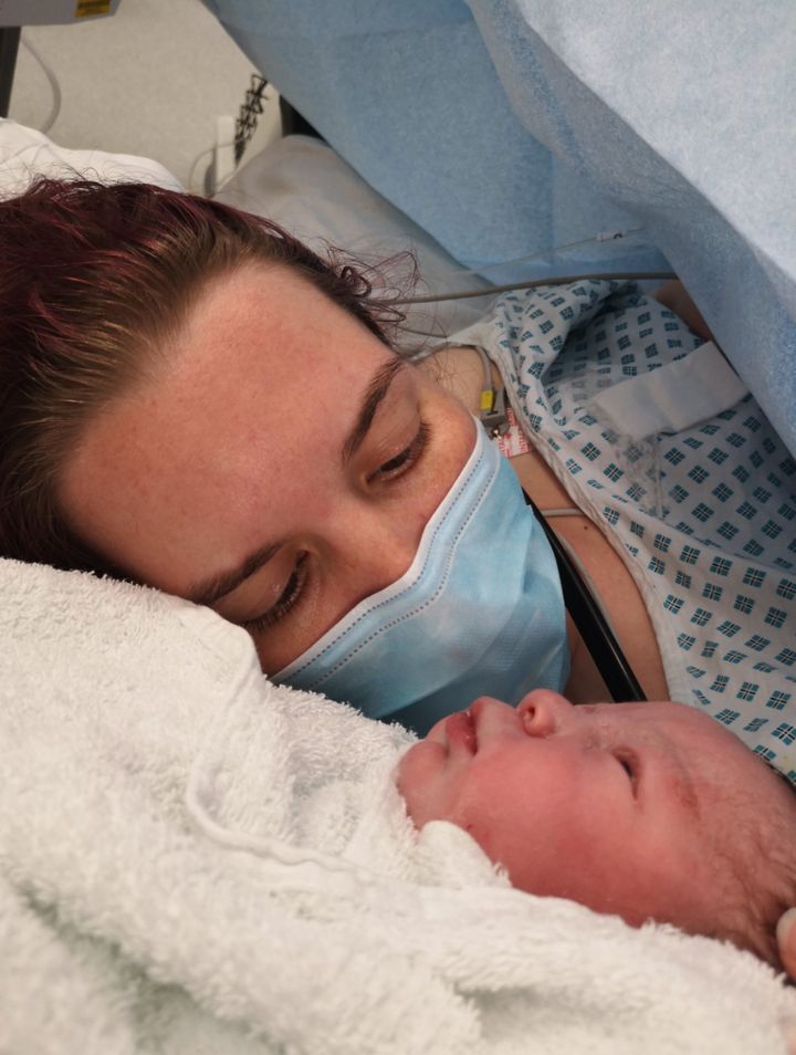 "This photo was taken in May 2020, minutes after my son was born. I remember a surge of relief seeing him here, alive, and the desperation to have him in my arms. I wasn't able to hold him, so he was held next to me so I could kiss his head. The relief, joy and love juxtaposed beside the mask makes the image unforgettable. A timeless photo of mother and baby, dated by the presence of PPE. " – Anna Malnutt, 30, Derbyshire.