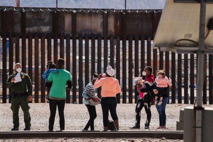 Border Patrol agents apprehend a group of migrants near downtown El Paso, Texas following the congressional border delegation