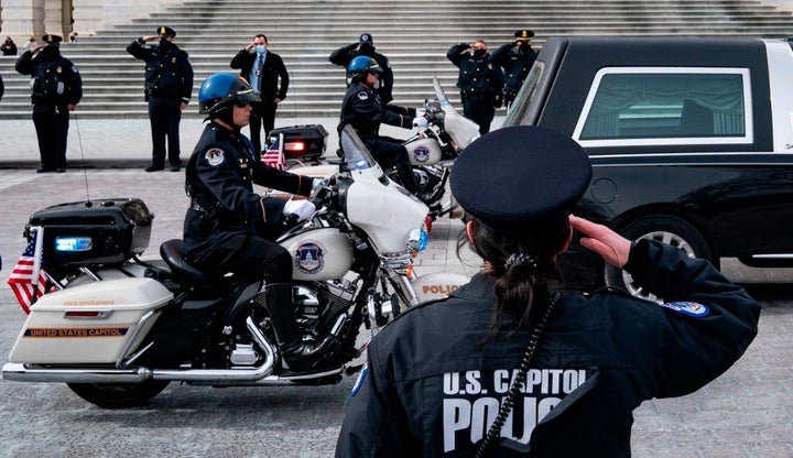 A hearse carrying the remains of U.S. Capitol Police Officer Brian Sicknick departs the Capitol on Feb. 3. Sicknick died afte