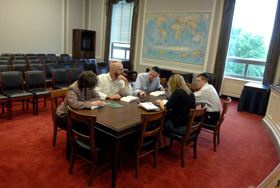 From left: Sharon Beth Kristal, Tom Jones, Dauster, Charlotte Ivancic, and Adam Samuel Roth conduct a Torah study group in 20
