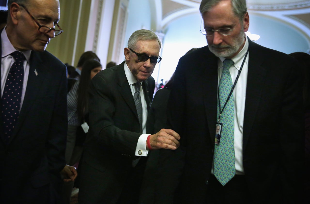 Dauster (right) remembers the day Reid (center) decided he would have to get rid of the filibuster for judicial nominations and Cabinet appointments.