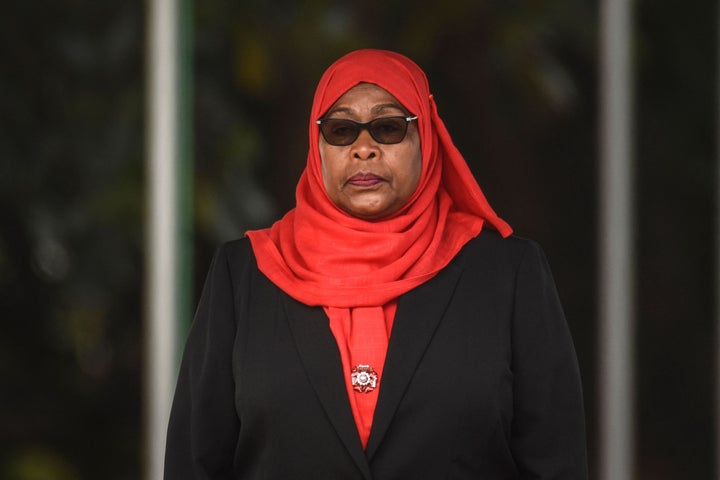 Tanzanian President Samia Suluhu Hassan inspects a military parade following her swearing in the country's first female presi
