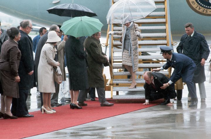 President Gerald Ford is helped to his feet after he slipped and fell as he was deplaning Air Force One in June 1975.