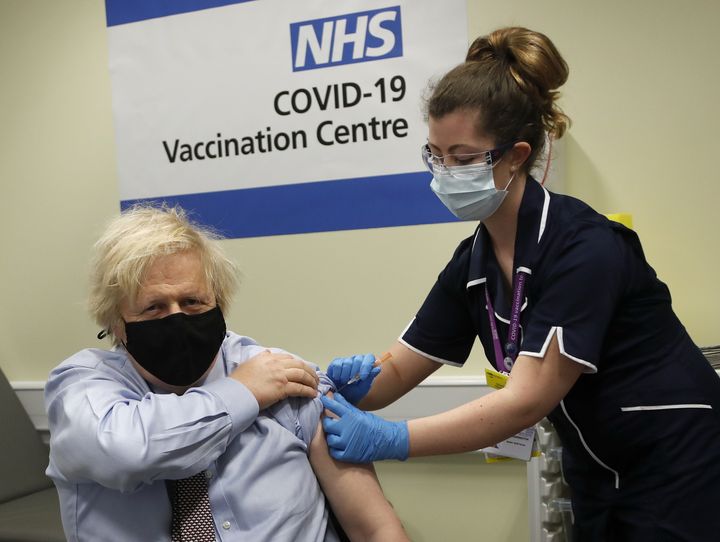 Boris Johnson receives the first dose of AstraZeneca vaccine administered by nurse Lily Harrington.