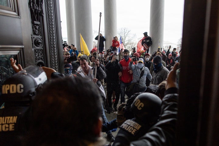 Police intervene as Trump supporters attempt to enter the Capitol building on Jan. 6.