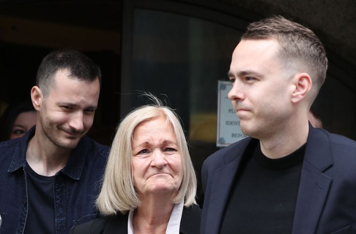 Sally Challen, flanked by her sons James (left) and David (right), leaves the Old Bailey after hearing she will not face a retrial over the death of her husband Richard Challen in 2010.
