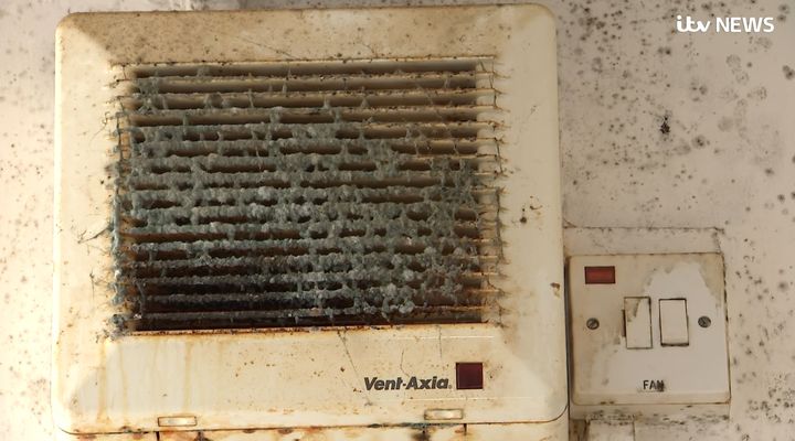 Damp in the tower block. It is not suggested that the fan in the image has caused the conditions pictured.