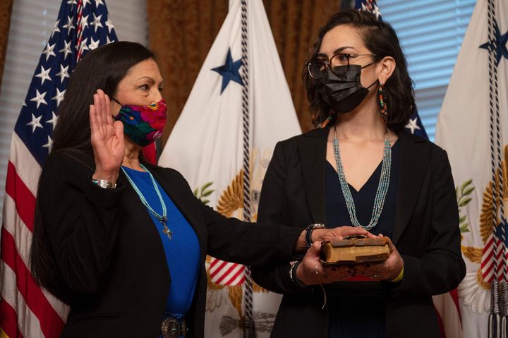 Interior Secretary Deb Haaland is sworn in as her daughter, Somáh Haaland, holds the Bible on March 18, 2021. 