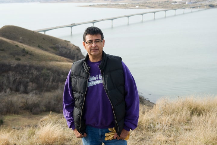 Mark Fox, who was running for tribal chairman at the time, poses at Crow Flies High Butte above the Missouri River in North D