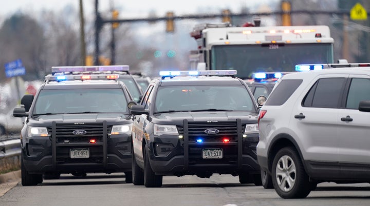 Police cars are parked outside a King Soopers grocery store where a shooting took place Monday in Boulder, Colorado.