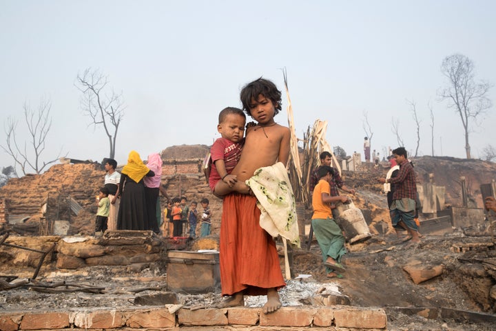 UKHIA, BANGLADESH - 2021/03/23: Rohingya children under an open sky after a huge fire swept through a Rohingya refugee camp in southern Bangladesh on Monday, destroying thousands of homes and killing at least seven people in the worst blaze to hit the settlement in recent years, according to the Fire Service report. (Photo by Yousuf Tushar/LightRocket via Getty Images)