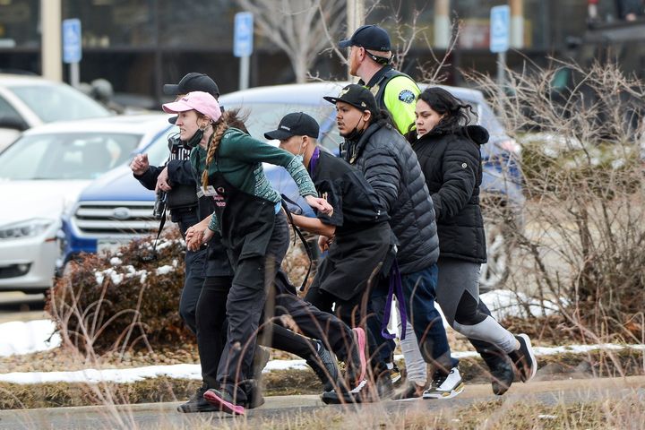 King Soopers employees being led away from an active shooter at the grocery store on Monday. 