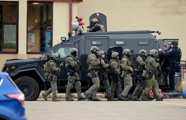 Police use an armored vehicle as a shield to move from one side of the building to the other at King Soopers in Boulder on Monday.