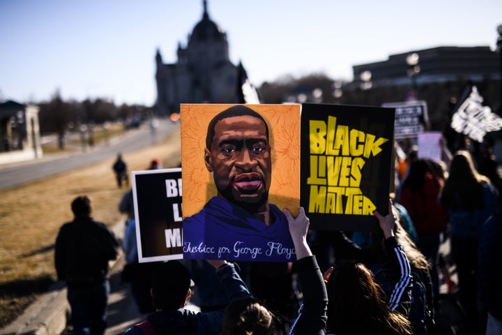 ST PAUL, MN - MARCH 19: People march near the Minnesota State Capitol to honor George Floyd on March 19, 2021 in St Paul, Min