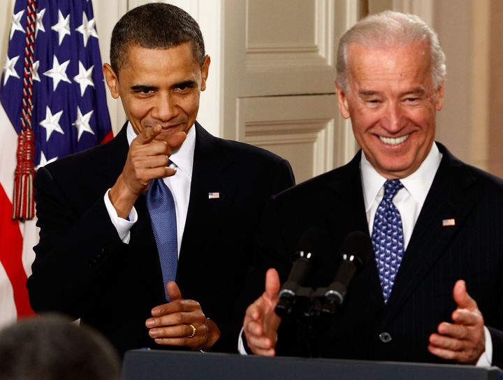 Then-President Barack Obama and Vice President Joe Biden receive a standing ovation during the signing ceremony for the Affordable Health Care for America Act on March 23, 2010.