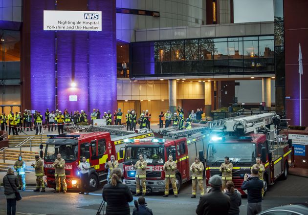 Members of the fire brigade, construction workers and members of the public, clapping outside the Nightingale Hospital Yorkshire in Harrogate to salute local heroes.